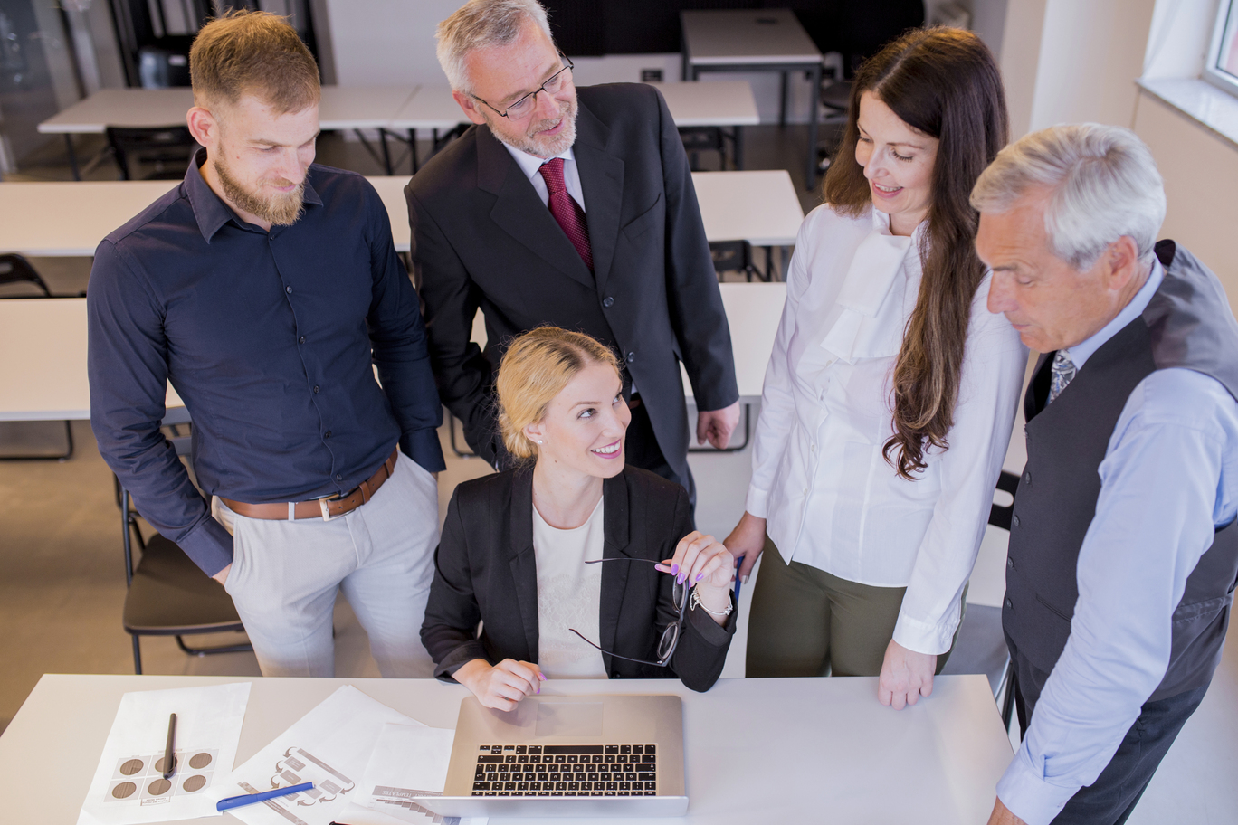 667fd2f28f735b1f23c2cc6d_overhead-view-confident-business-team-office (1)